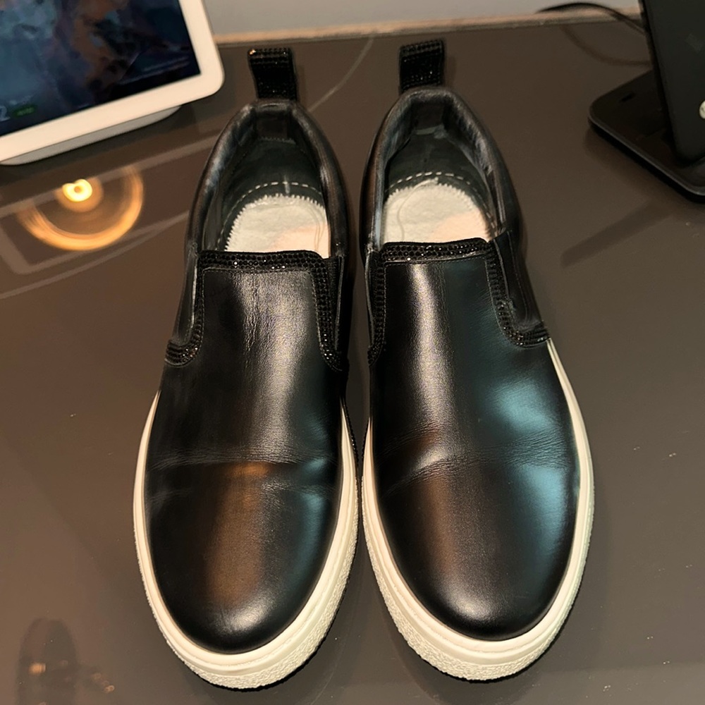 Rene Caovilla sparkly black dressy sneakers.